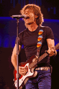 Mick_Jagger_in_2005_with_Silvertone_1457_playing_slide.jpg