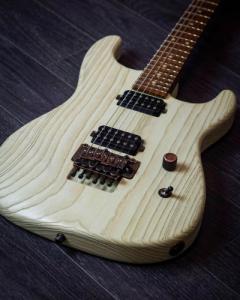 Luxxtone El Machete. The blackened copper hardware really pops on the Bone White finish and the Roasted Flame Maple neck 1.jpg