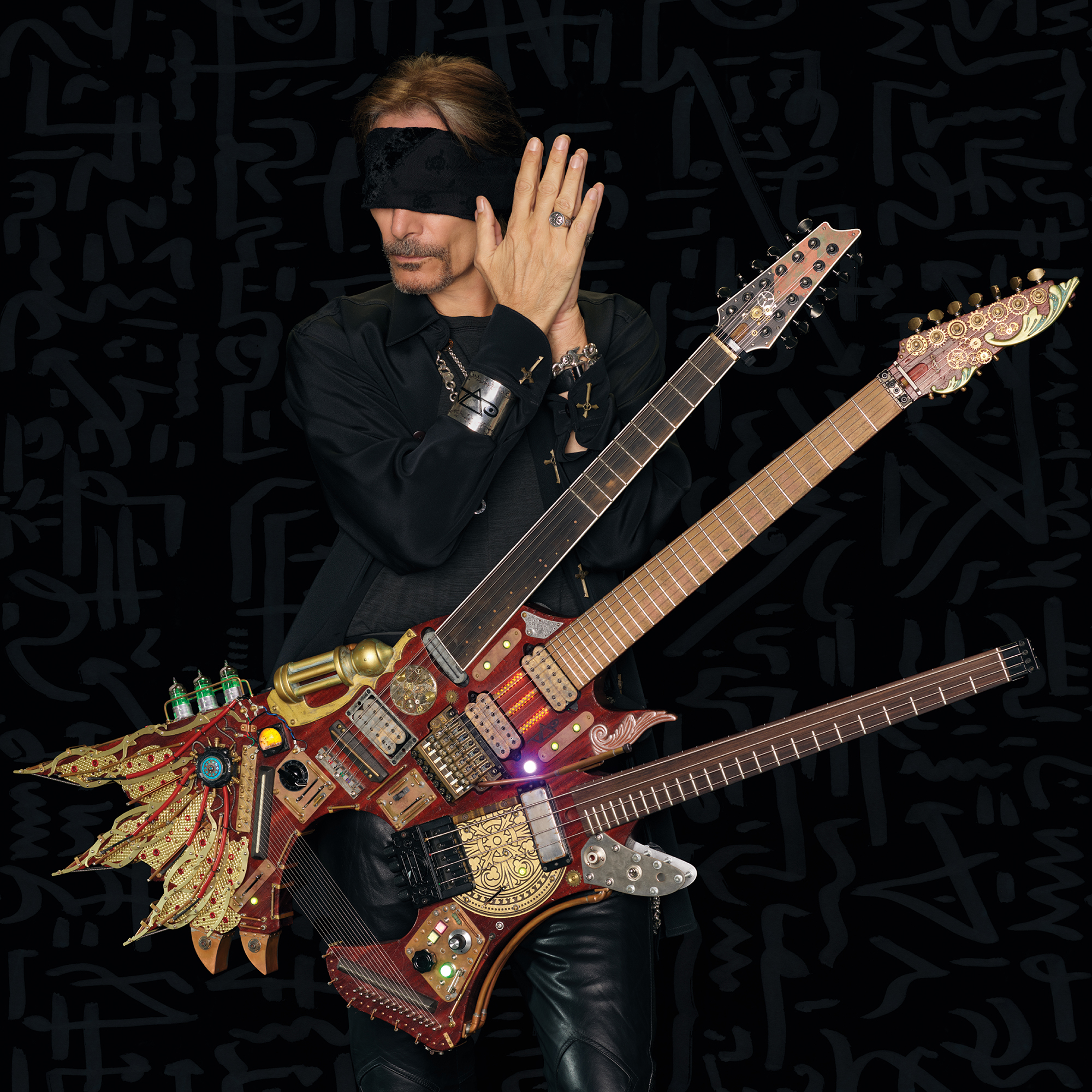 Steve Vai estrena el tercer single de su álbum "Inviolate" y una  guitarra/bajo de 3 mástiles | Guitarristas.info